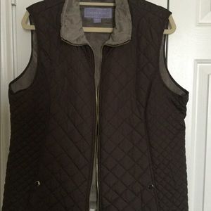 Brown vest with silver lining.